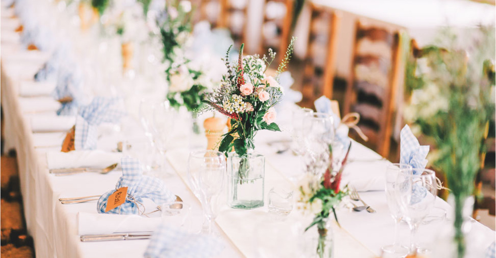Long table set up with flowers and fine china